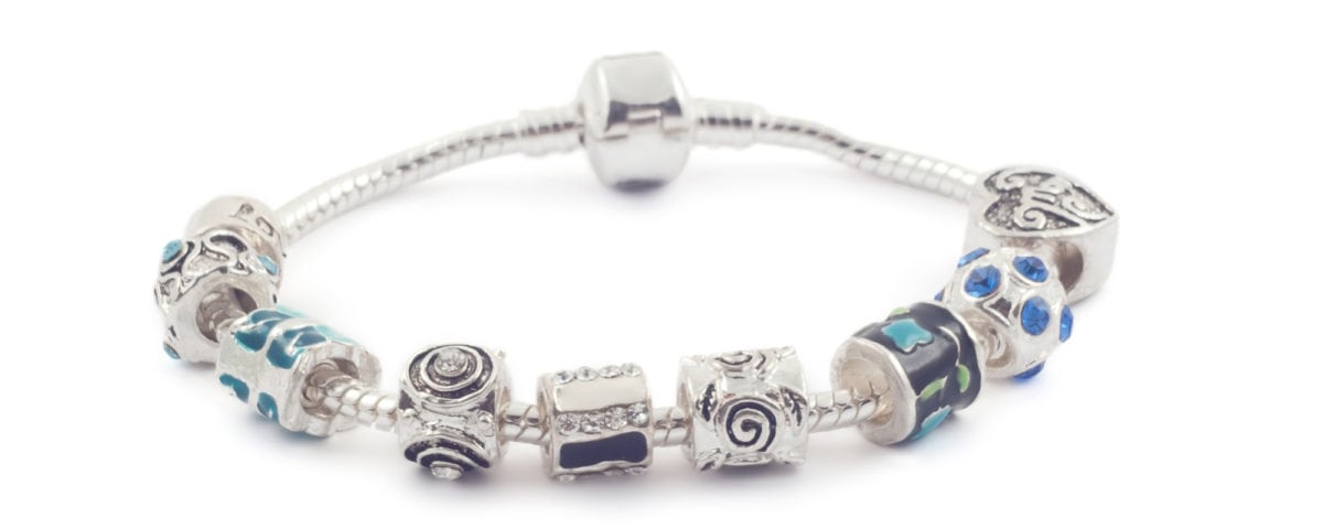 Silver bracelet with beads on white